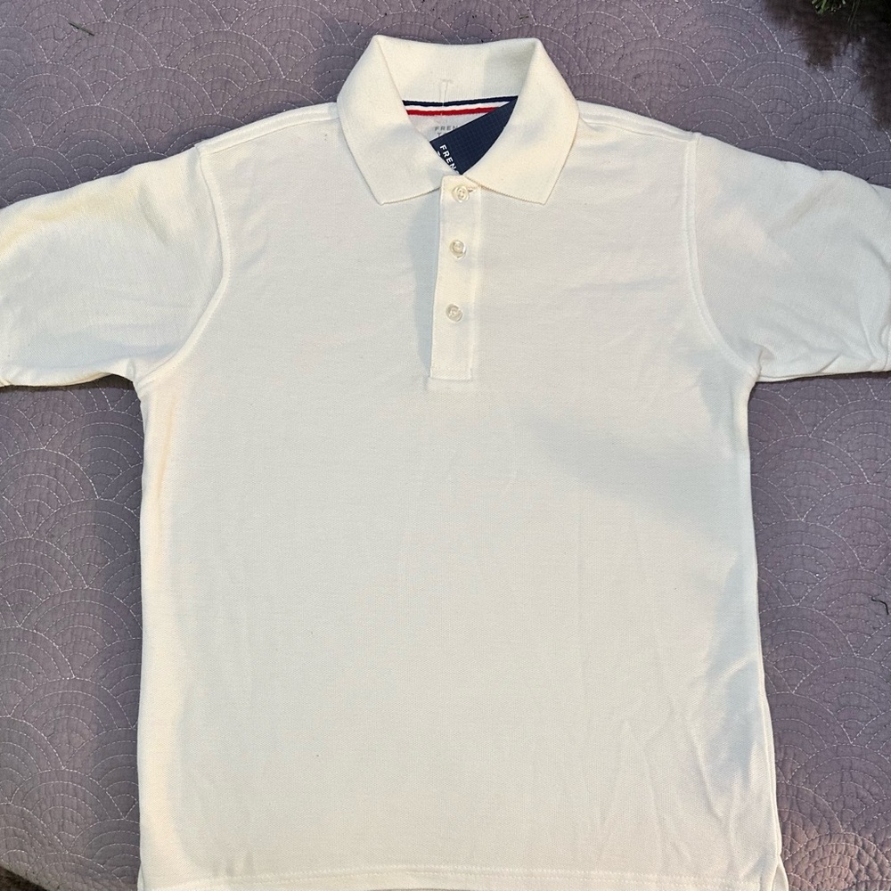This French Toast uniform polo shirt is a must-have for any young student.